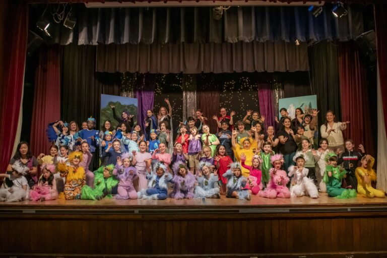 Blue Cast Photo with Teachers and Volunteers (Magic It Up 2025)